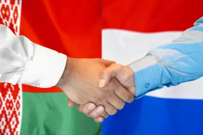 Handshake on the background of Bulgaria and Serbia flag